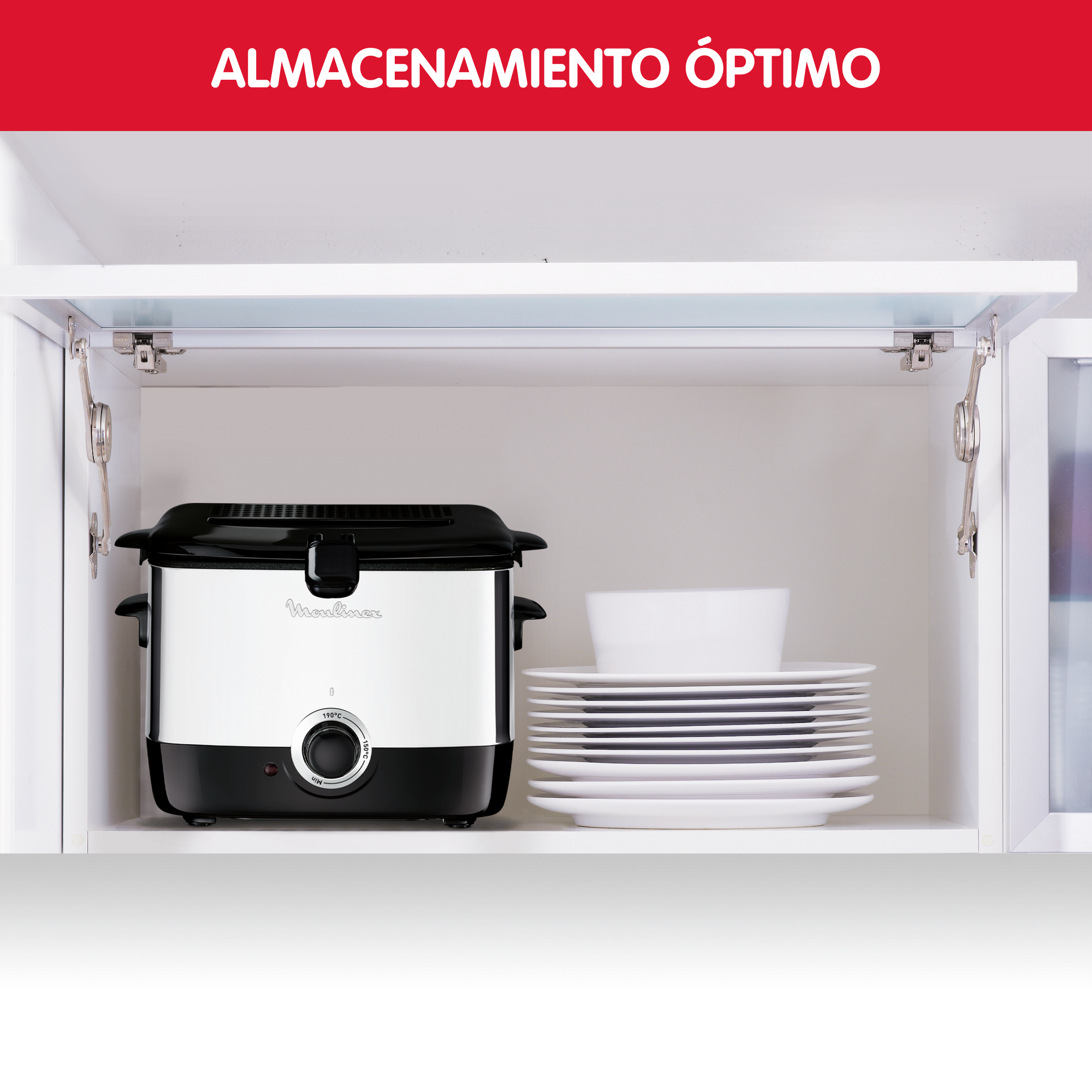 Una freidora negra y blanca se guarda en un armario blanco. Hay platos encima.