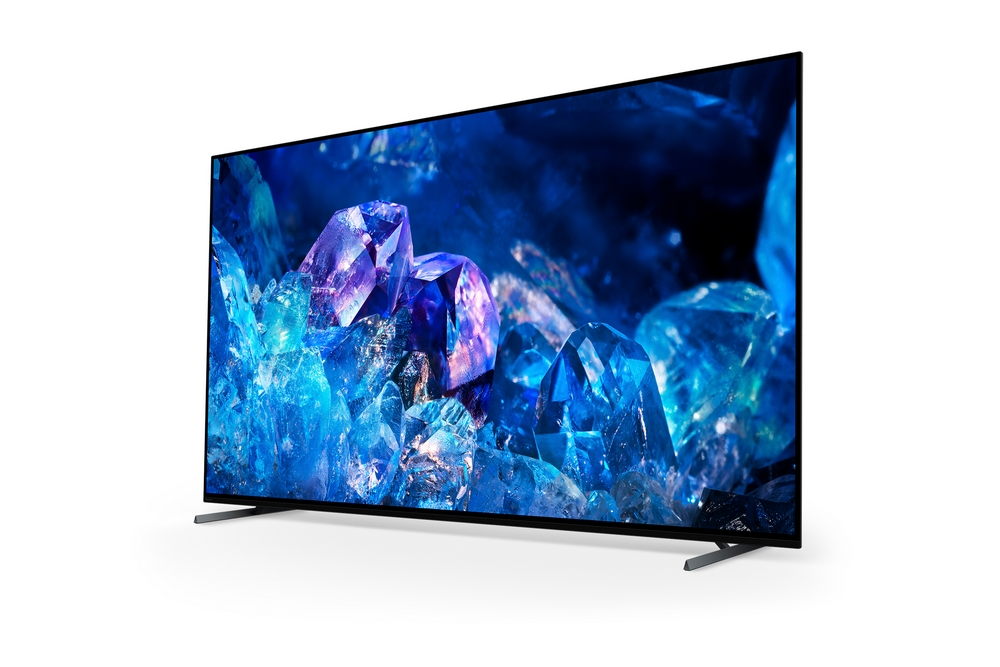 Una pantalla de TV grande y moderna que muestra cristales azules. El televisor tiene un marco negro.