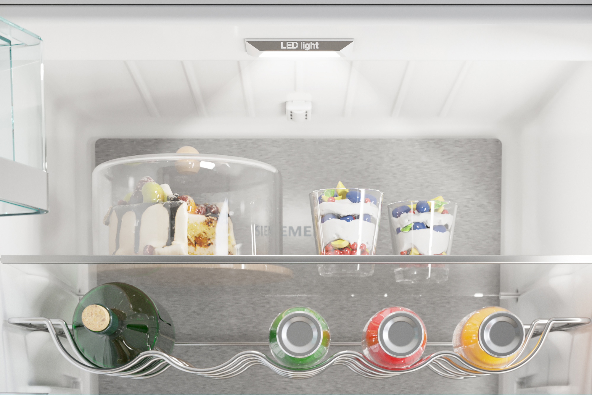 Refrigerator interior with cake, desserts, and bottles, shelves visible.