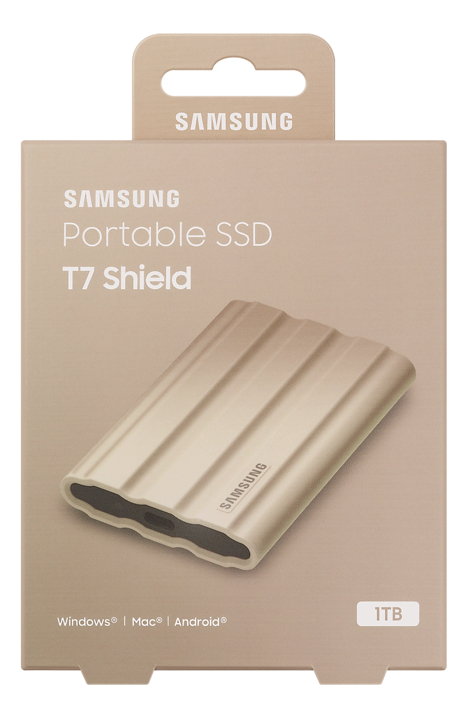 Egy Samsung Portable SSD T7 Shield bézs dobozban, a látható SSD-vel. A dobozon a 'T7 Shield' felirat látható.