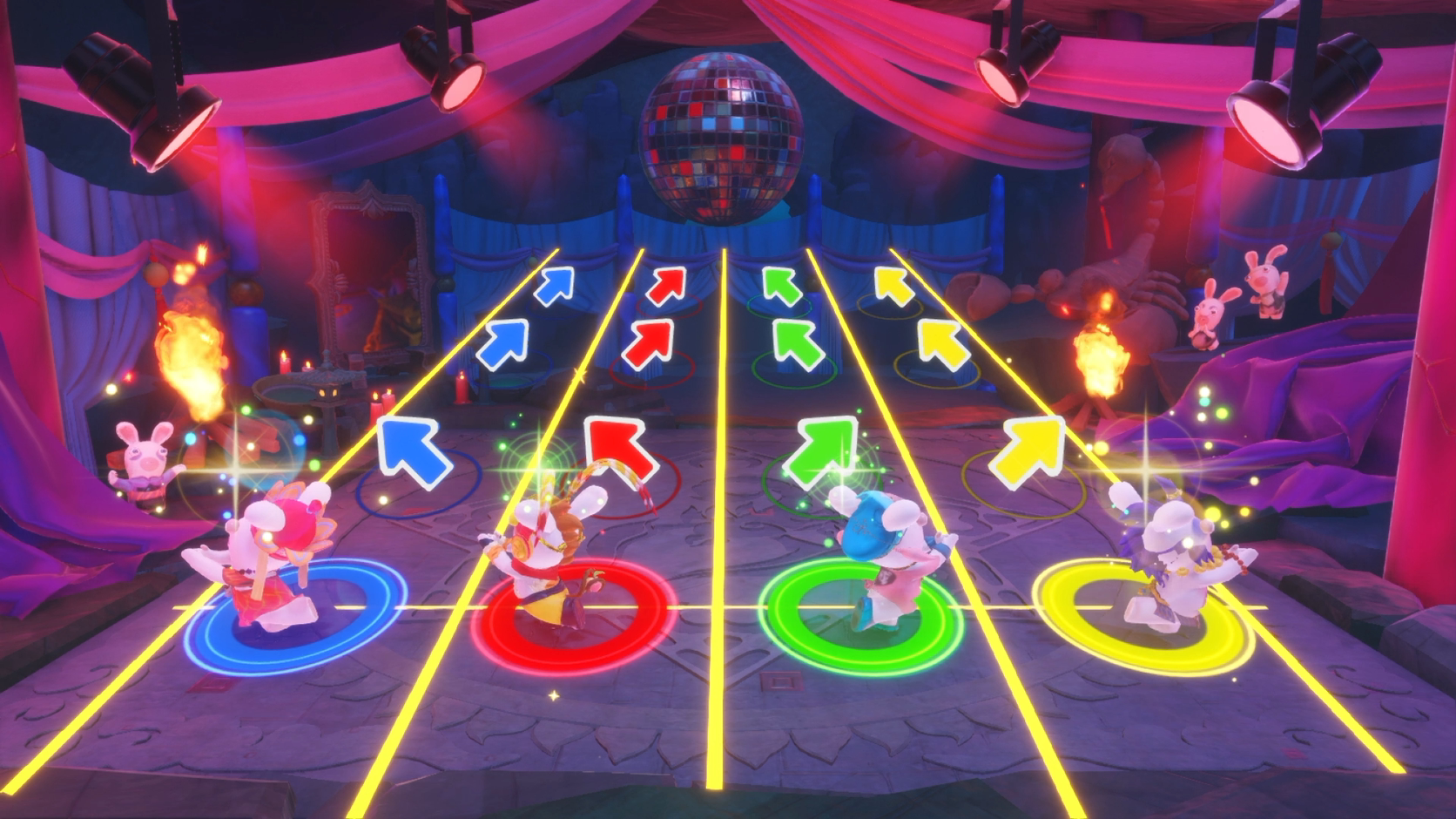 Een videogame scène met dansende konijnen op een podium. Pijlen en een discobal zijn zichtbaar.