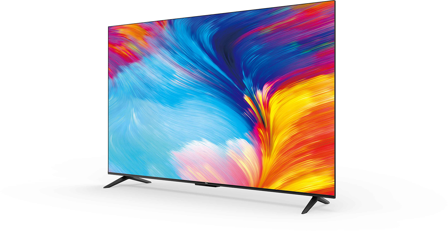A large, modern TV displays colorful abstract art. It has two black legs and is on a white surface.