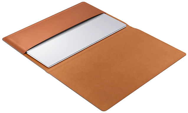Brown leather laptop sleeve with silver laptop inside.
