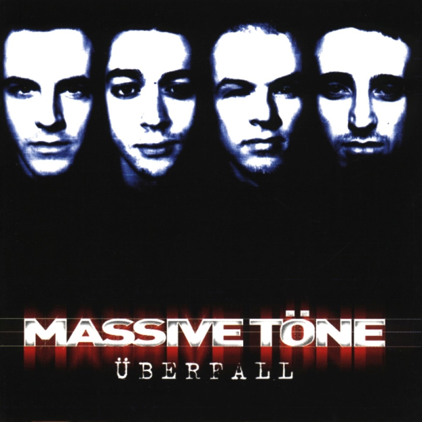 Albumcover: Massive Töne - Überfall, mit vier Gesichtern und rotem Text.