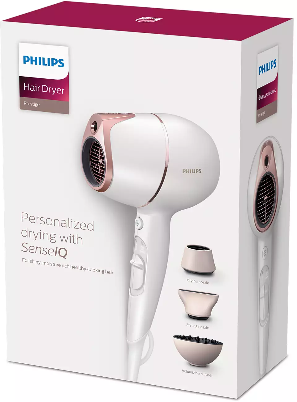 White and rose gold Philips hair dryer with attachments in a box.