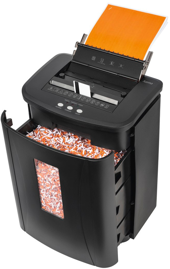 Déchiqueteuse de papier noire avec porte ouverte montrant du papier déchiqueté et une pile de papier.