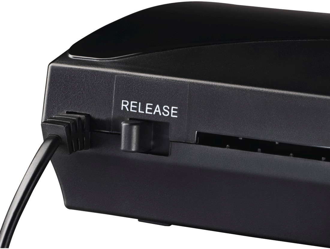 The back of a black electronic device with the word RELEASE printed on it.