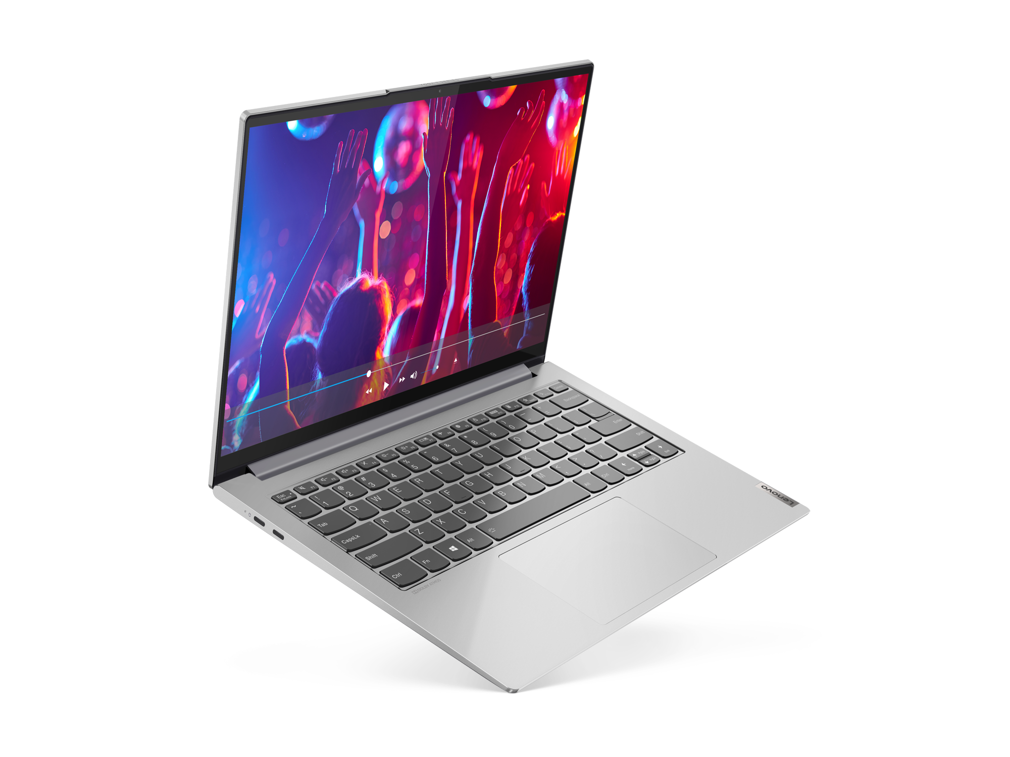 Silberner Laptop mit einem Bildschirm, der eine farbenfrohe Konzertszenen zeigt, auf schwarzem Hintergrund.