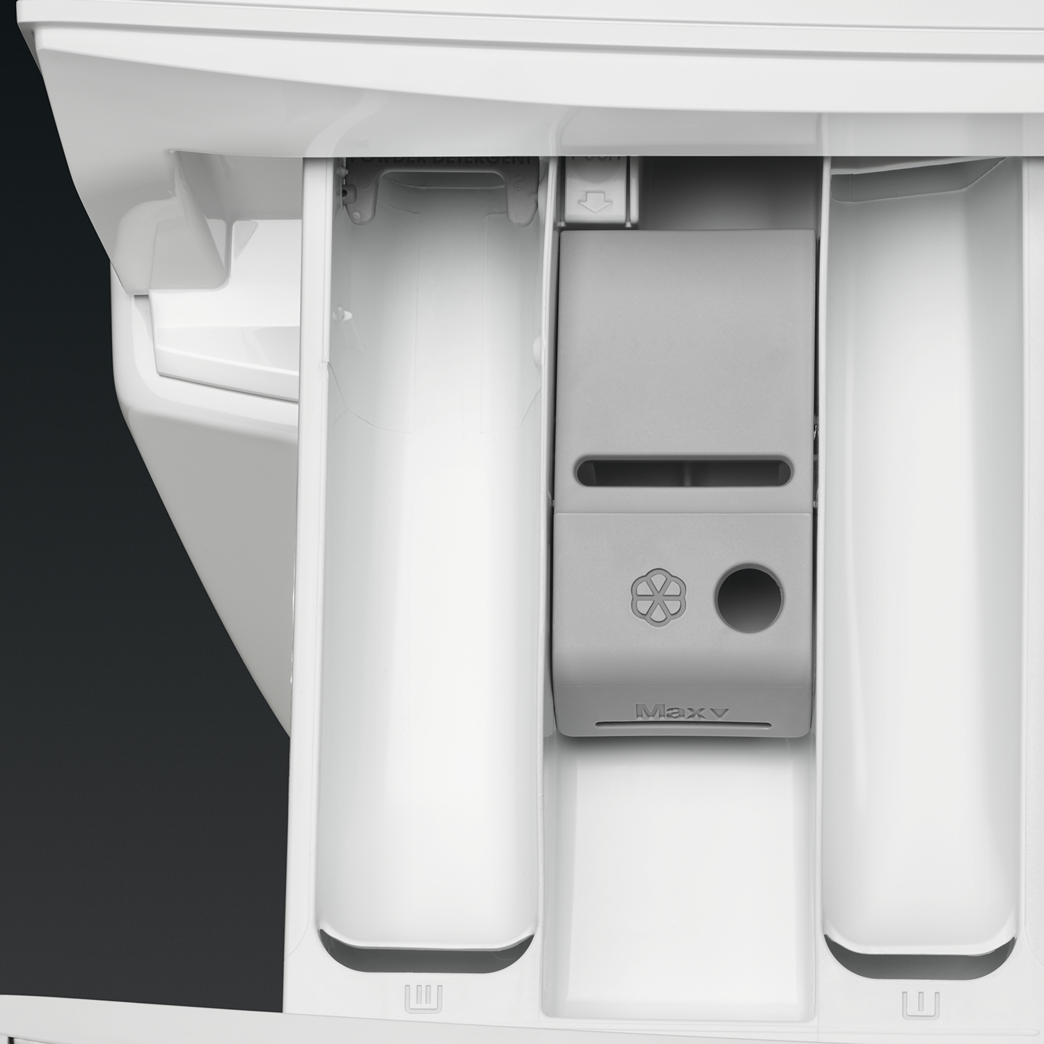 Primo piano di un cassetto bianco della lavatrice. Contiene scomparti per detersivo e un design floreale.