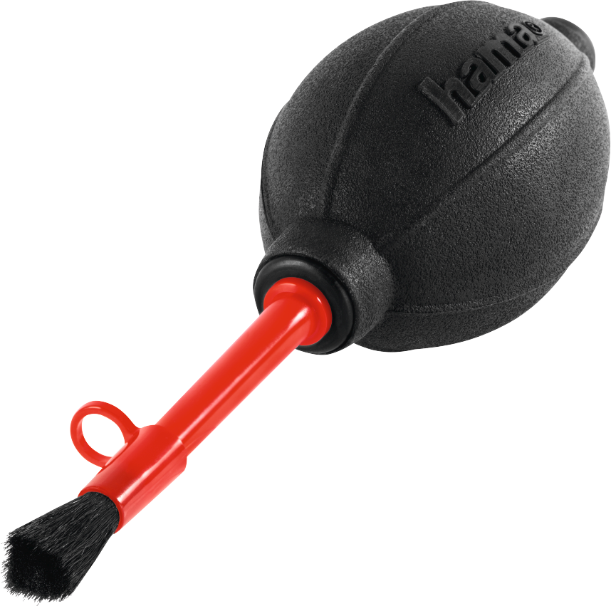 Une soufflette pour appareil photo noire avec une buse rouge et une petite brosse fixée.