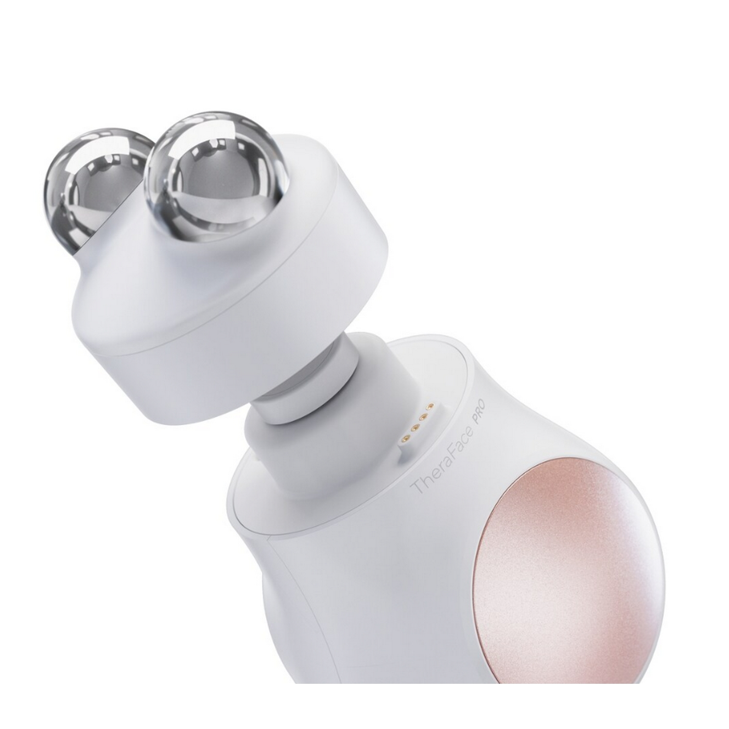 Masajeador facial blanco con dos bolas plateadas y una base oro rosa.
