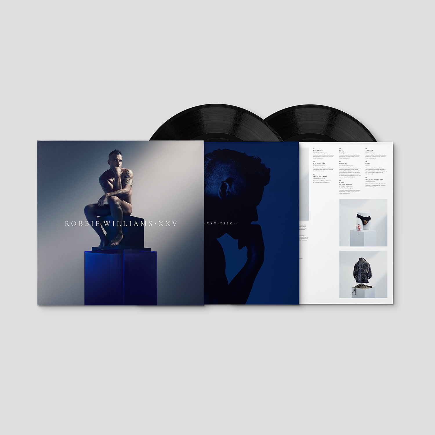 Robbie Williams Albumcover, offen. Zeigt schwarze Vinyls, ein Foto von Robbie und weitere Bilder.