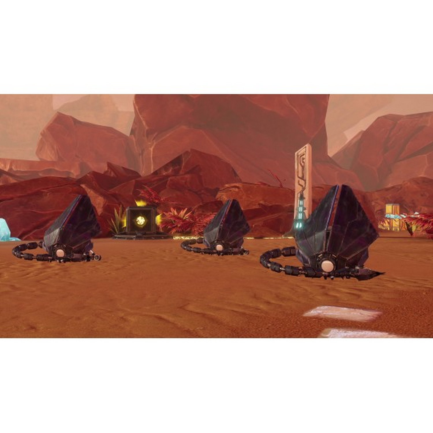 Tres robots oscuros, metálicos, tipo insecto sobre una superficie rojo-naranja. Fondo con formaciones rocosas.