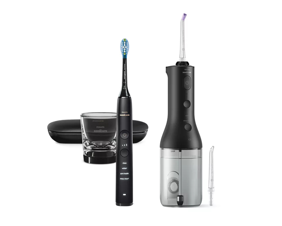 Schwarze Philips Sonicare Zahnbürste und Wasserflosser auf weißem Hintergrund.