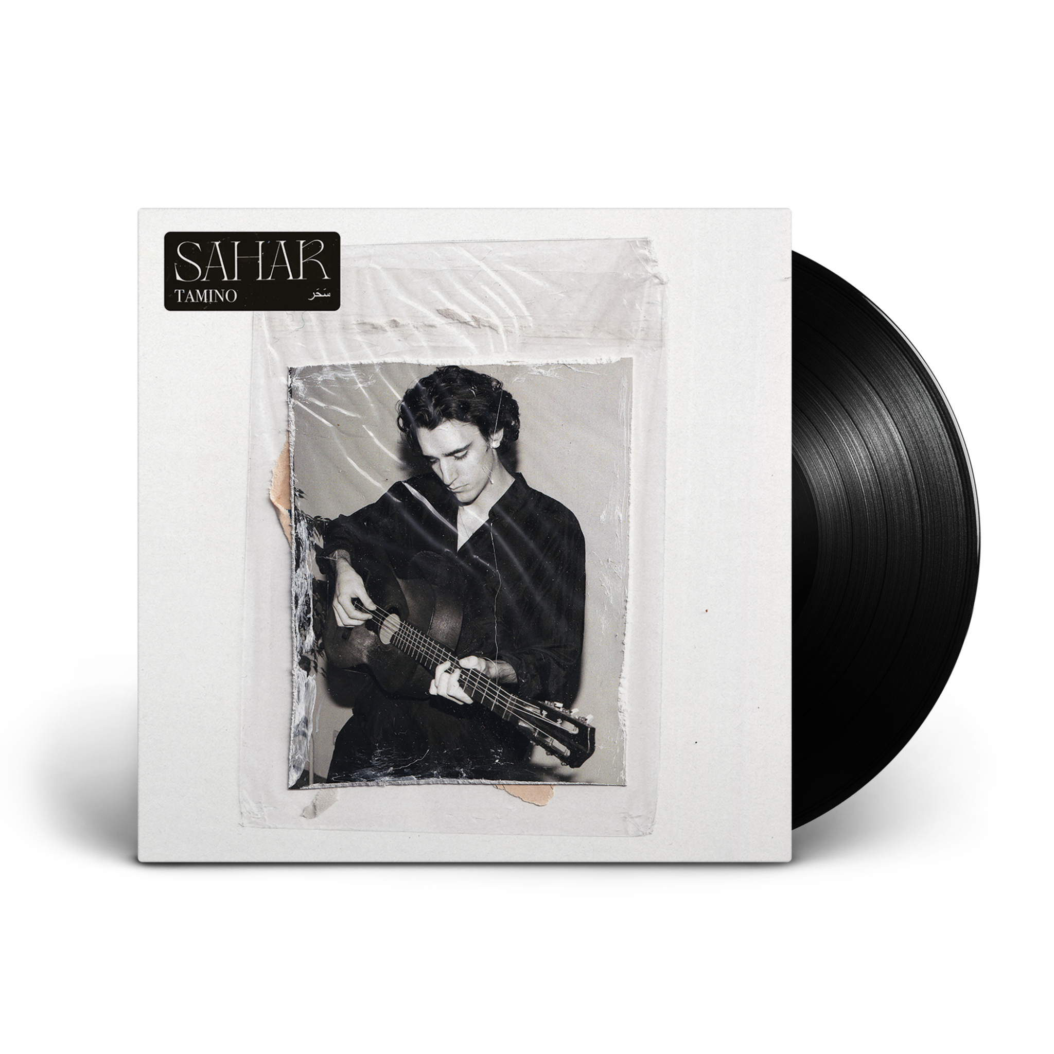 Albumcover. Schwarze Schallplatte neben einem Albumcover mit einem Mann, der Gitarre spielt.