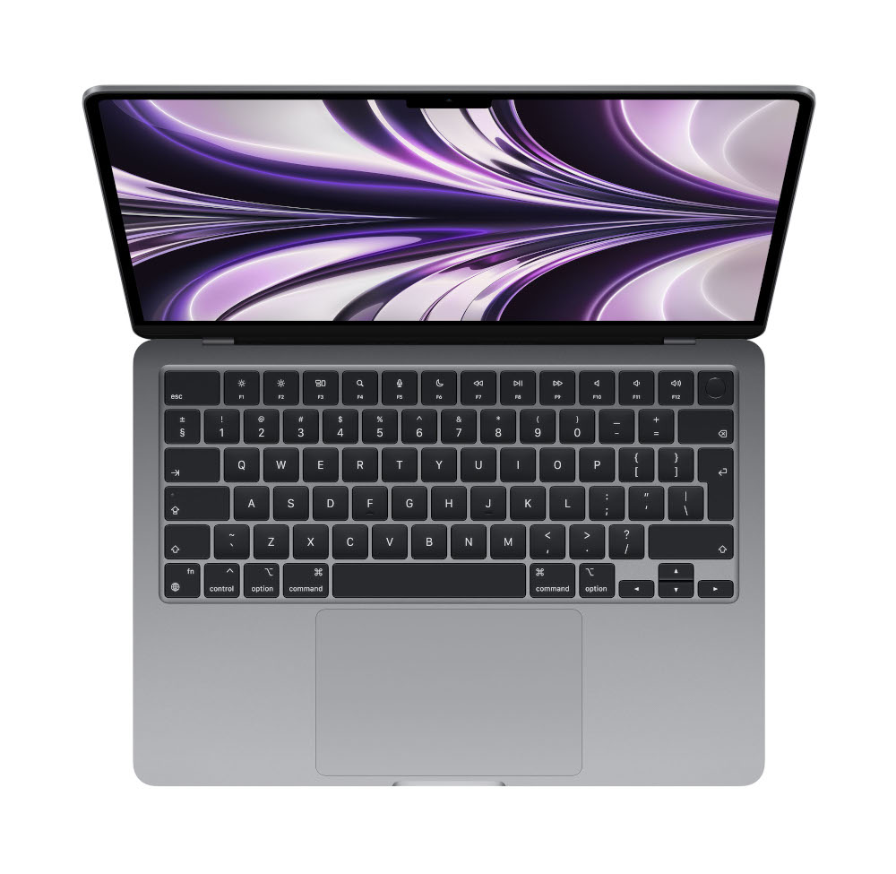 Bovenaanzicht van een grijze laptop met toetsenbord op witte achtergrond.