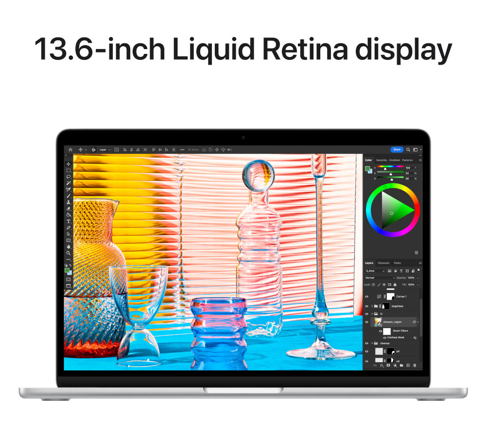 L'écran de l'ordinateur affiche une image colorée. Le texte '13.6-inch Liquid Retina display' est en haut.