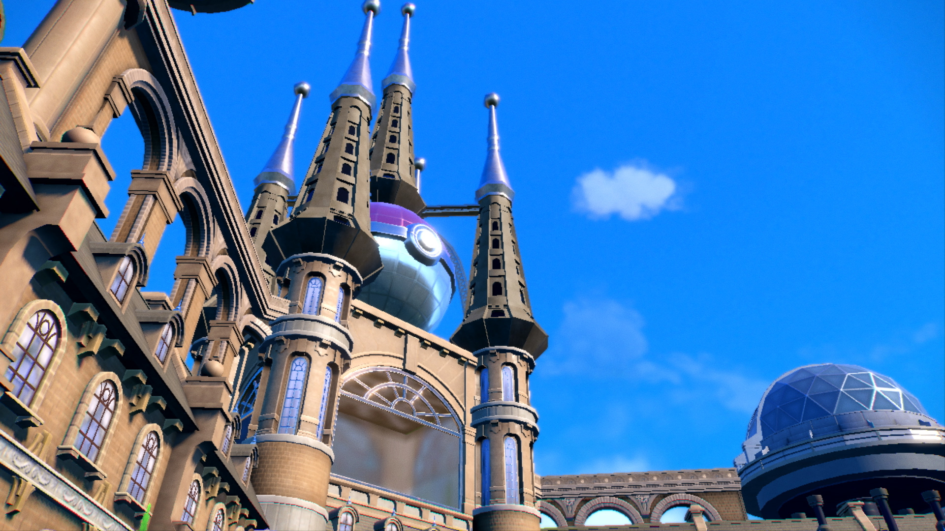 Bâtiment fantastique avec des tours, une grande structure de pokeball et ciel bleu.