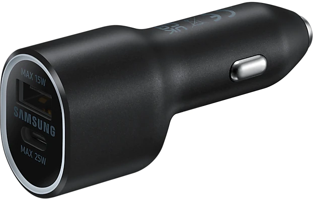 Een bovenaanzicht van een grijze Logitech Pebble muis en toetsenbord op een blauwe achtergrond.