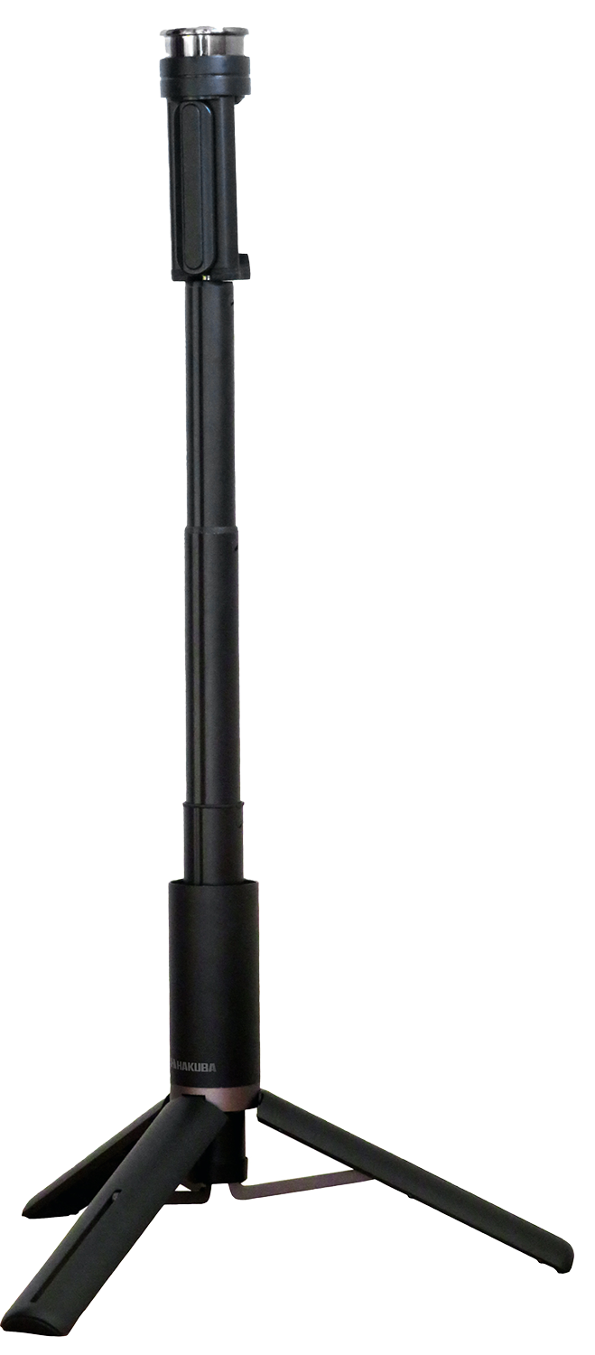 Black tripod for a camera or phone. It is extended. Isolated on a black background.