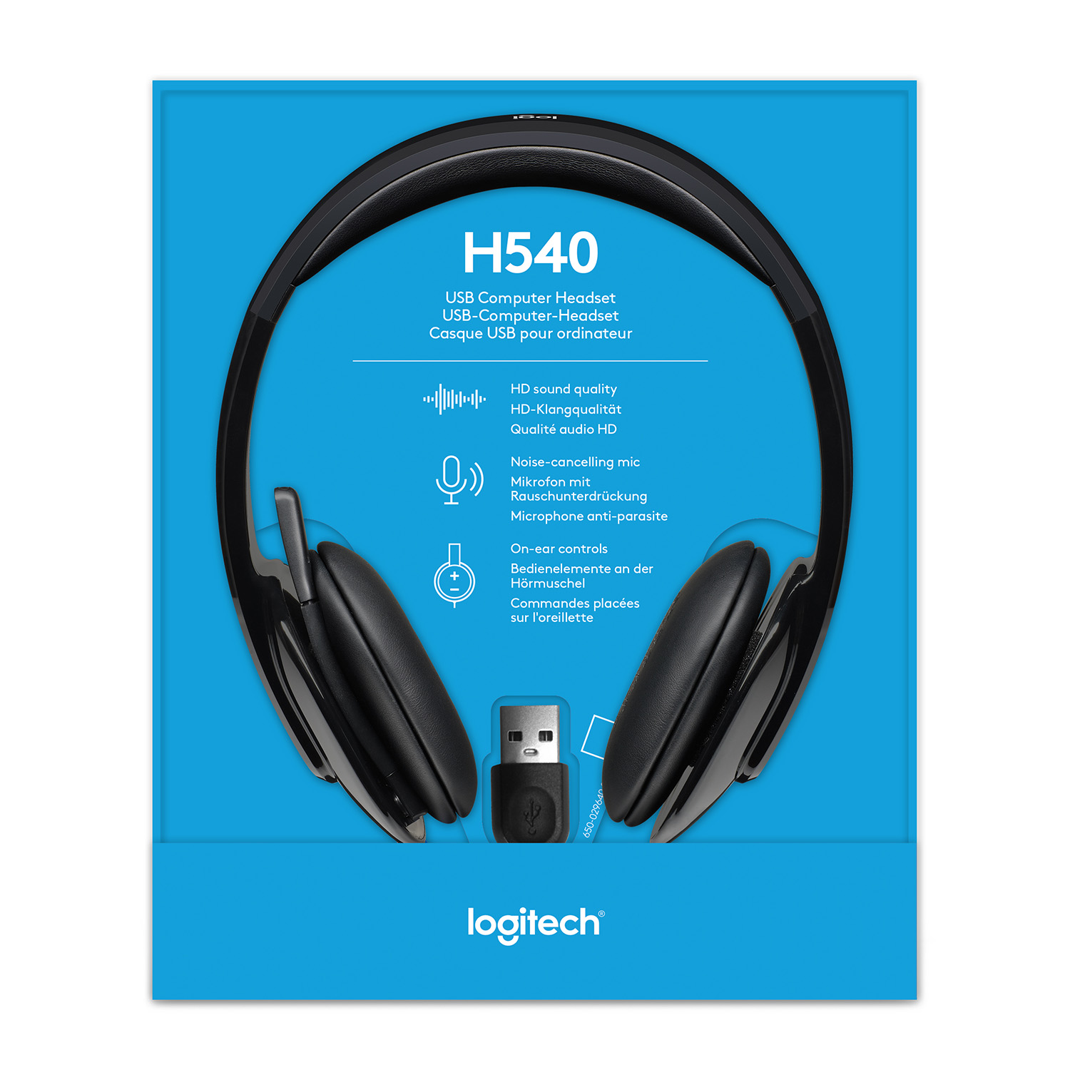 Auriculares negros con conector USB y controles en la oreja, mostrados en una caja.