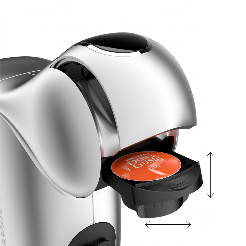 Una cafetera plateada con una cápsula de café naranja insertada.