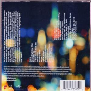 Dos du CD de l'album des Rolling Stones. Texte sur une scène nocturne urbaine floue.
