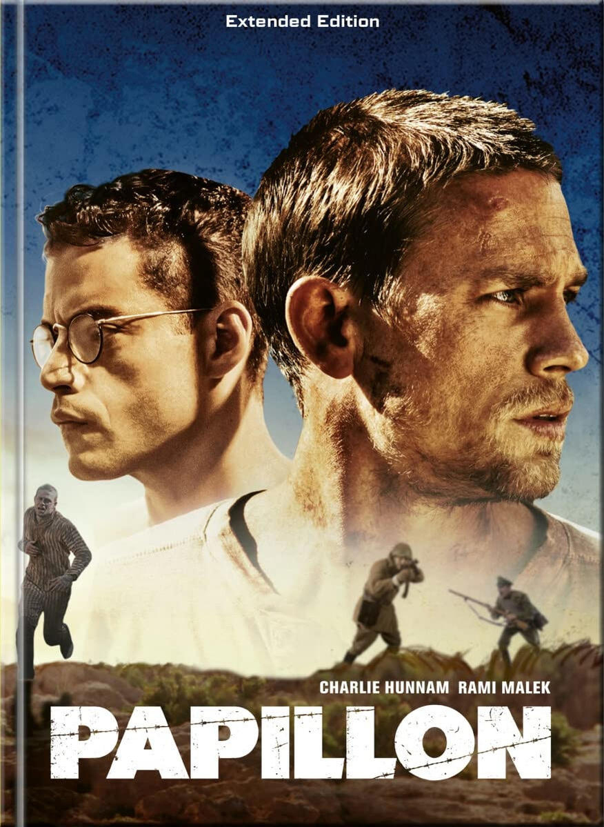 Filmplakat: Papillon. Zwei Männer, einer mit Brille, andere rennen, Soldaten, Gefängnis, dramatisch.
