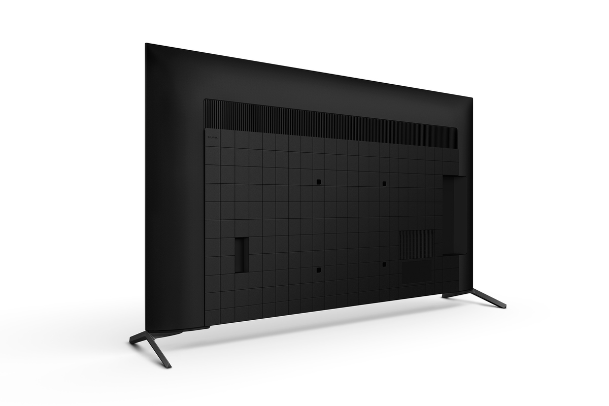 Beyaz bir arka plan üzerinde siyah bir TV'nin arka görünümü. TV, ızgara benzeri bir arka kısma ve iki bacağa sahiptir.