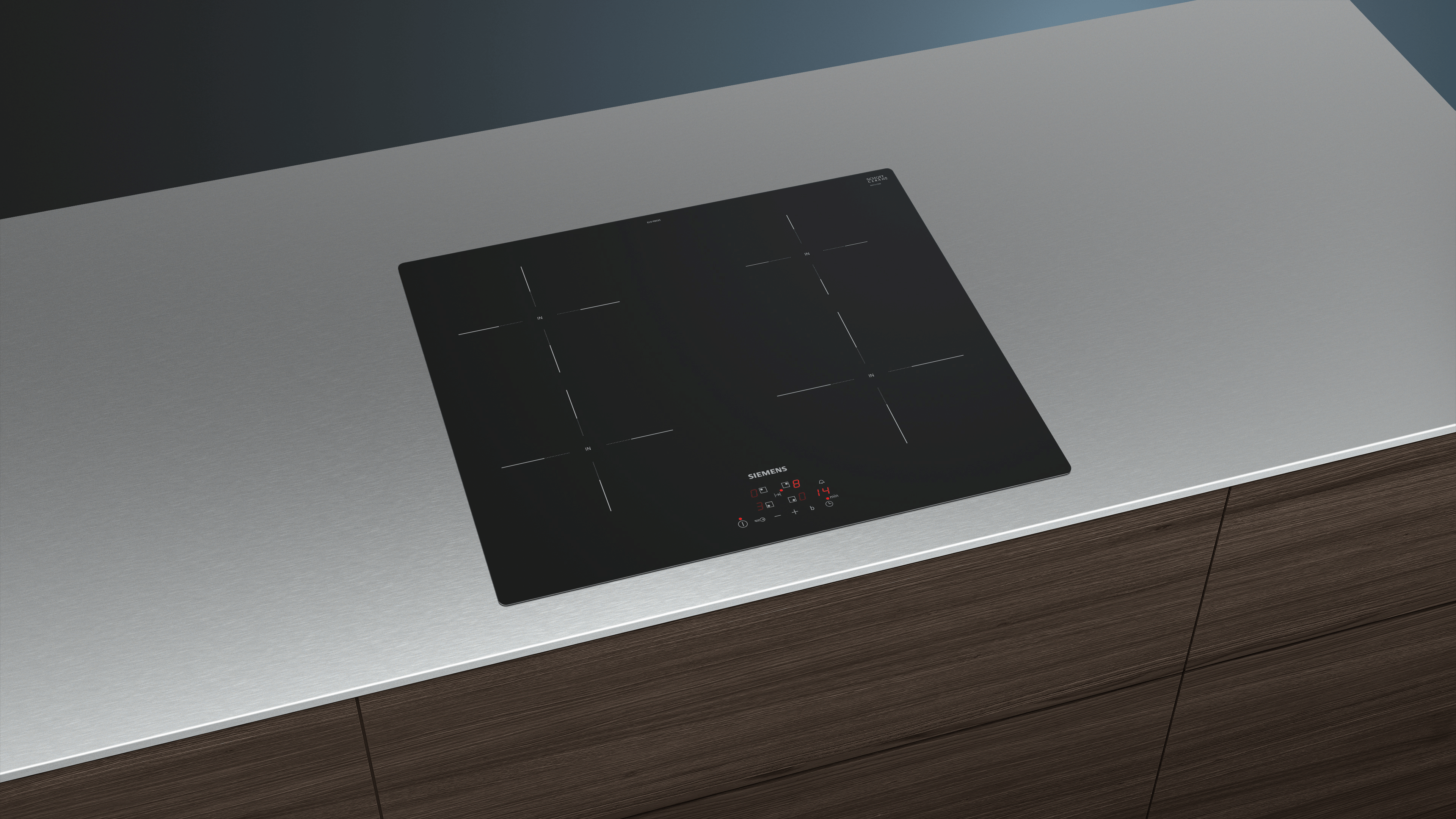 Black built-in cooktop on a light-colored countertop.