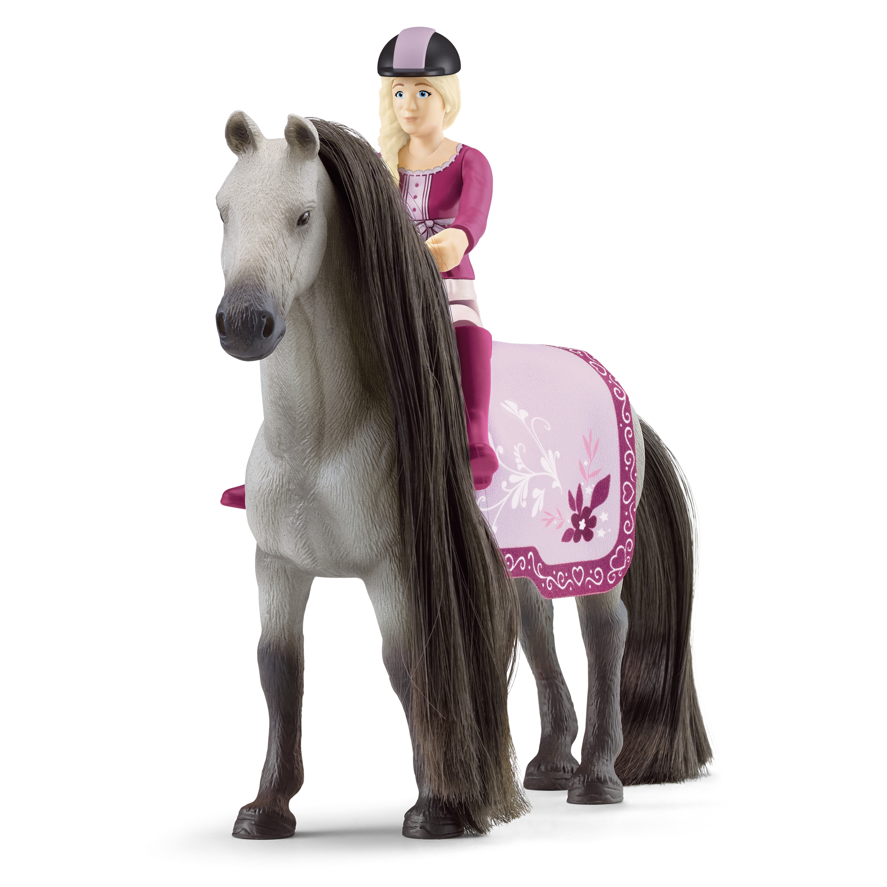 Ein Spielzeugpferd mit einem Reiter in rosa Kleidung.