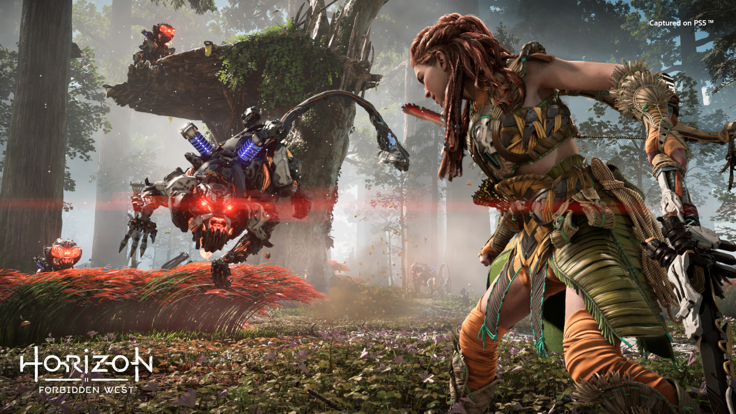 Aloy battles a robotic creature in a forest. Another robot sits on a branch.