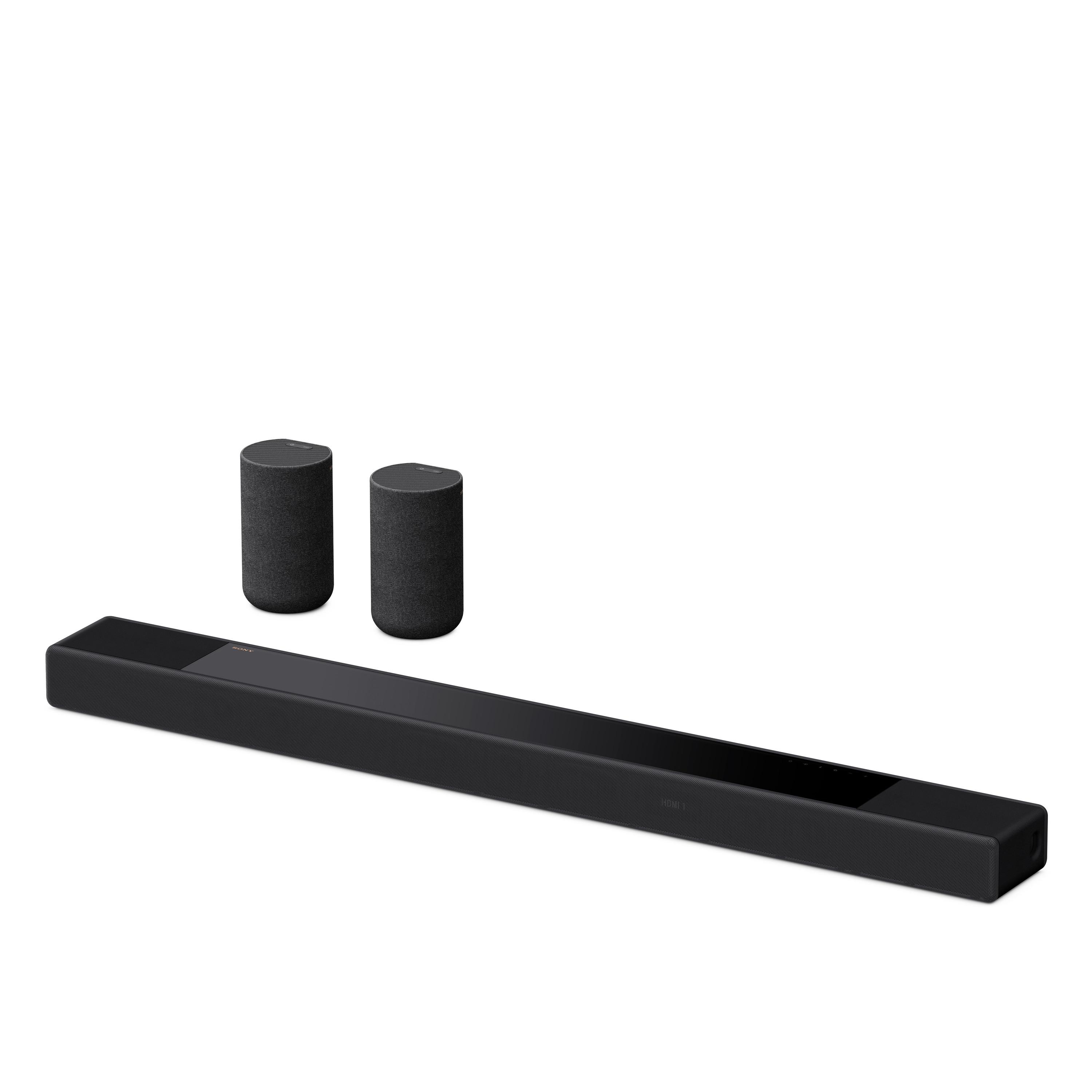 Schwarze Soundbar mit zwei zylindrischen Lautsprechern auf weißem Hintergrund.