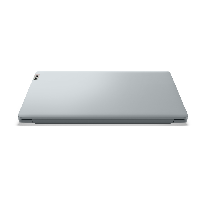 Laptop cerrado, gris claro sobre fondo negro. El logo de Lenovo está en la esquina superior izquierda del portátil.