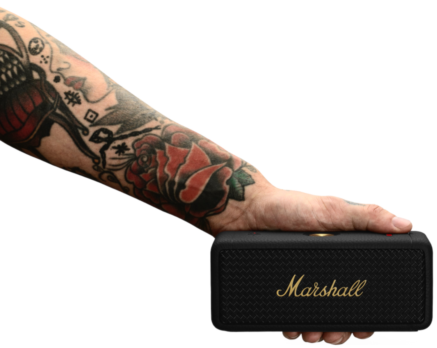 A person holding a black Marshall speaker. The speaker has a gold Marshall logo.