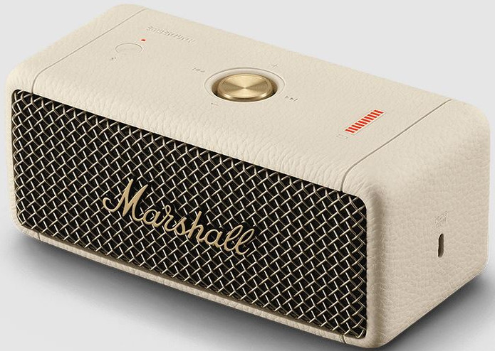 Gebroken witte Marshall-luidspreker met gouden accenten, luidsprekerrooster en bedieningselementen.