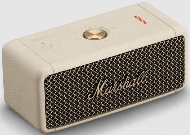 Crèmekleurige Marshall-luidspreker met een gouden bedieningsknop en een mesh voorkant.