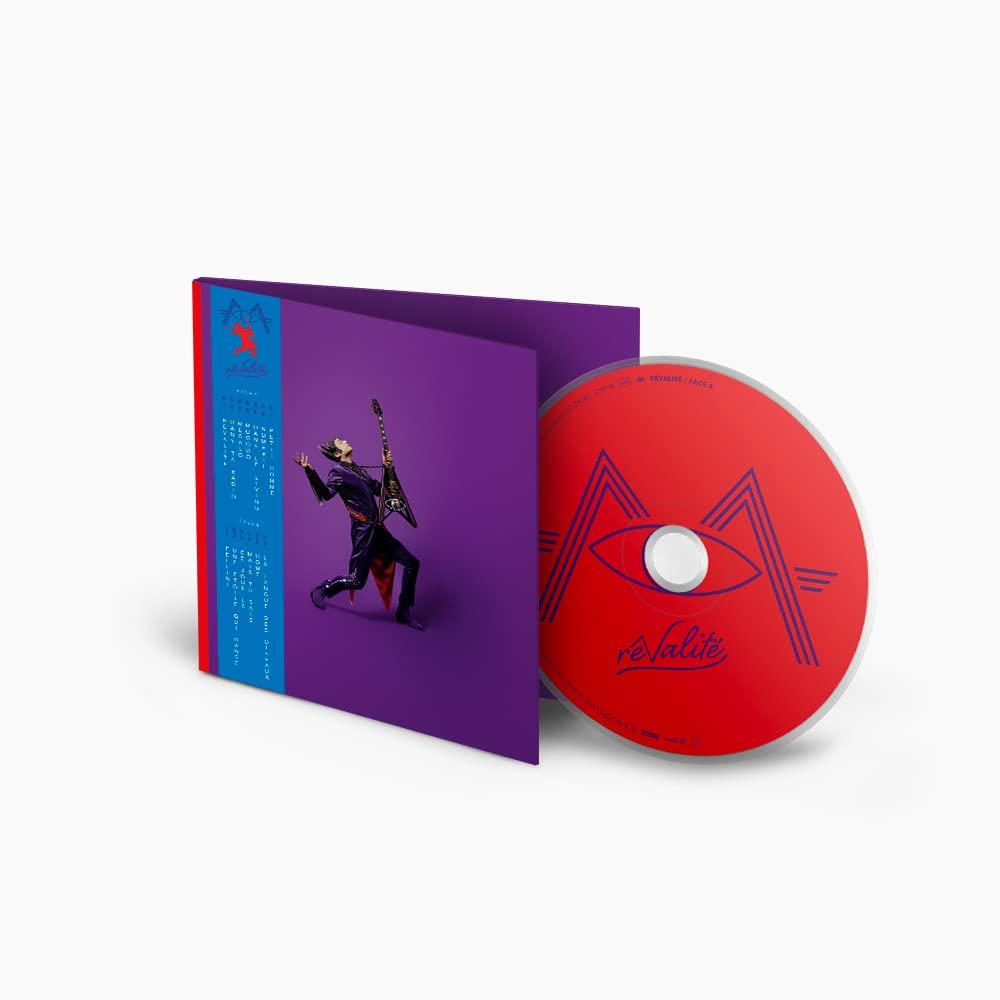 A CD case, open, showing a red CD with a white eye design and a person with a guitar.