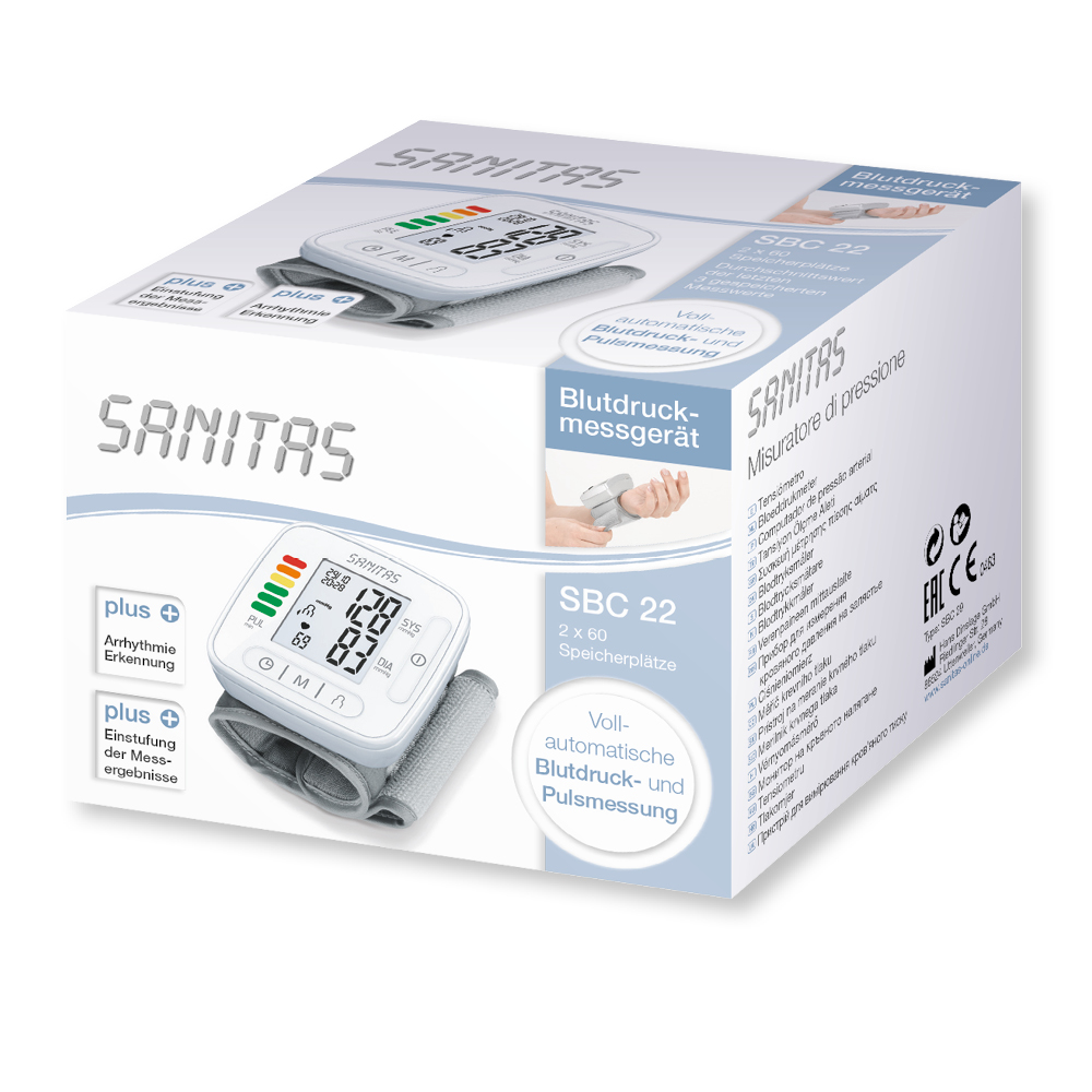 Box von Sanitas Blutdruckmessgerät. Das Gerät und die Anzeige sind abgebildet. Text ist in mehreren Sprachen.