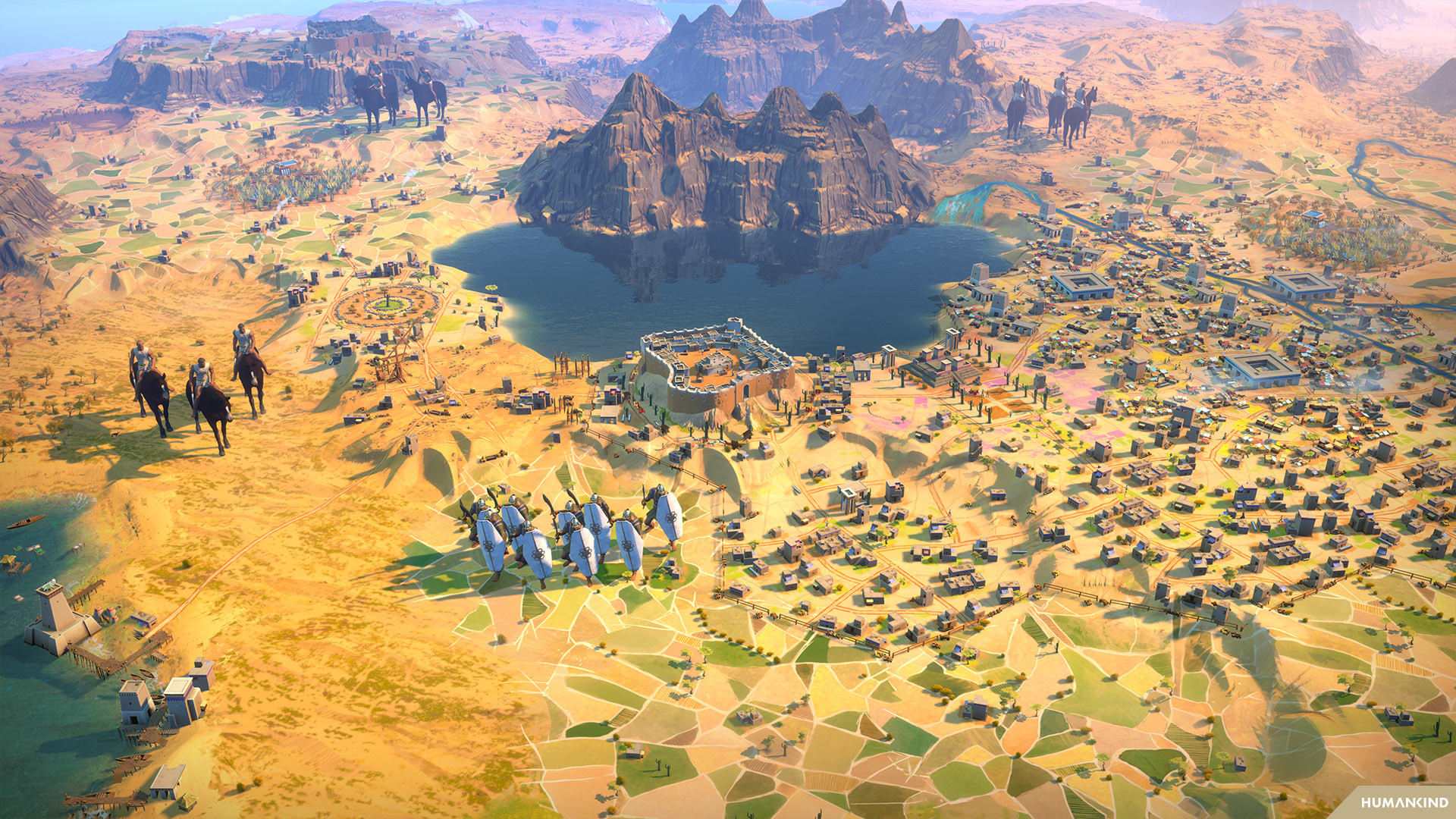 Eine Draufsicht auf eine Landschaft aus einem Videospiel mit Armeen und einem zentralen See.