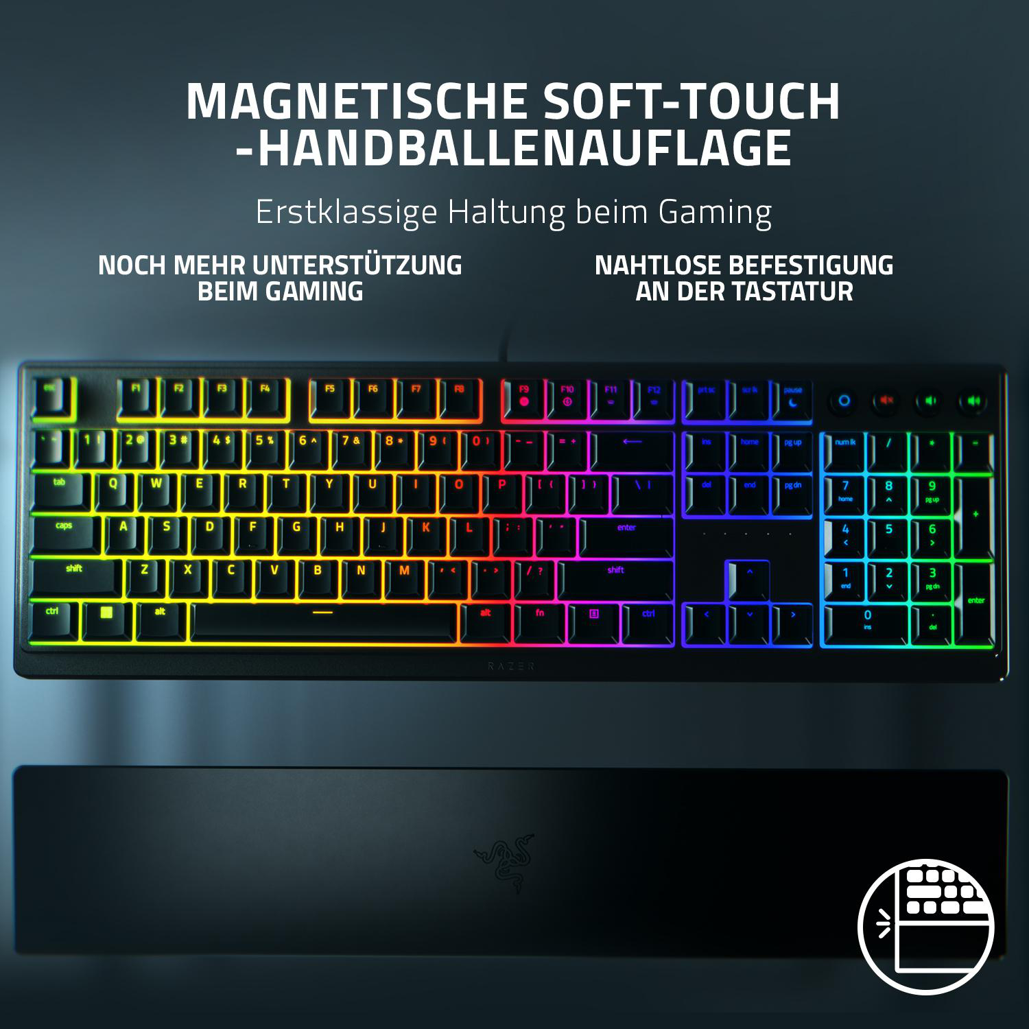 Schwarze Gaming-Tastatur mit Regenbogen-Hintergrundbeleuchtung. Handauflage darunter.
