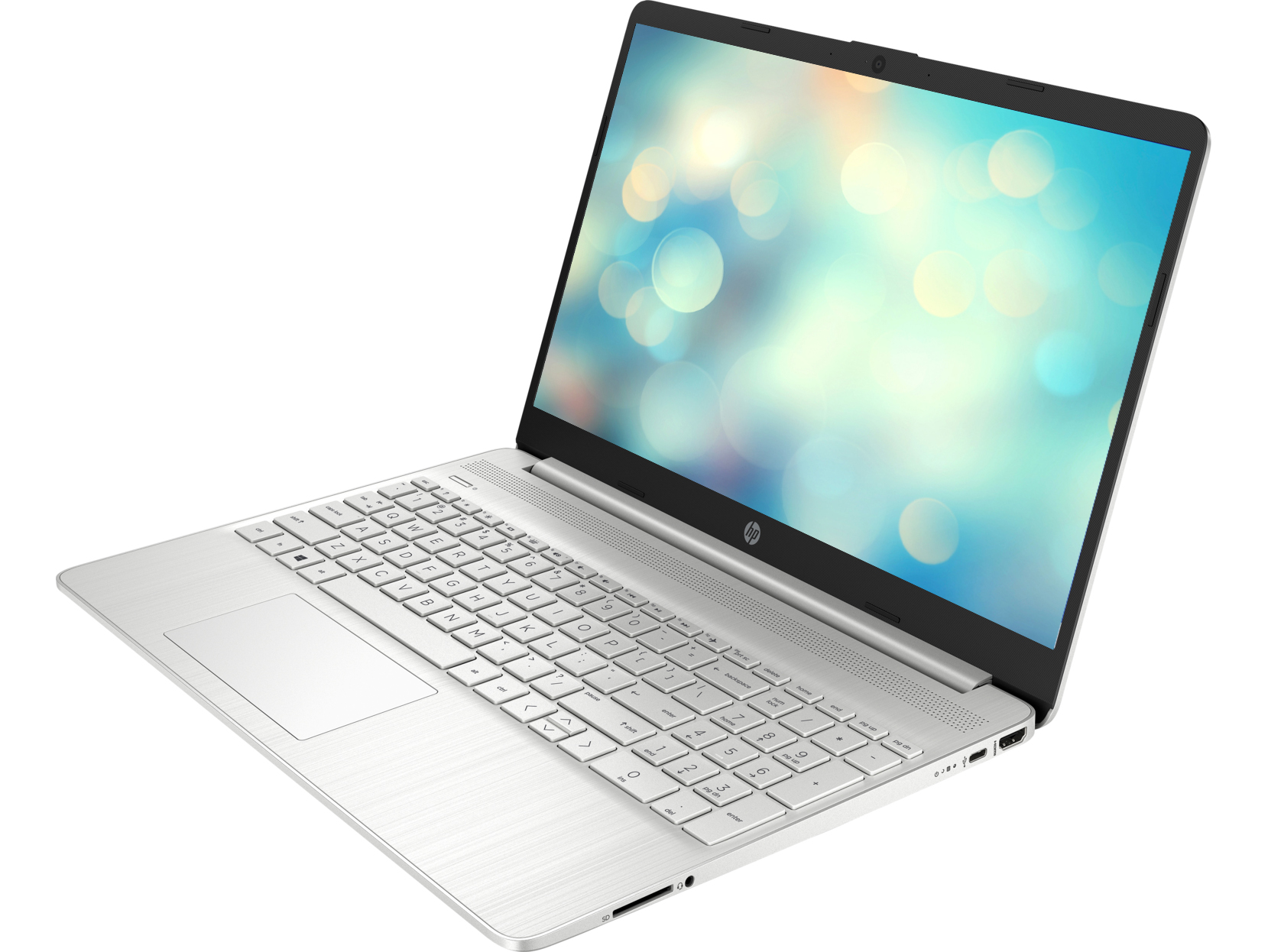 Ordenador portátil. Portátil plateado abierto con pantalla que muestra un fondo borroso. Teclado blanco.