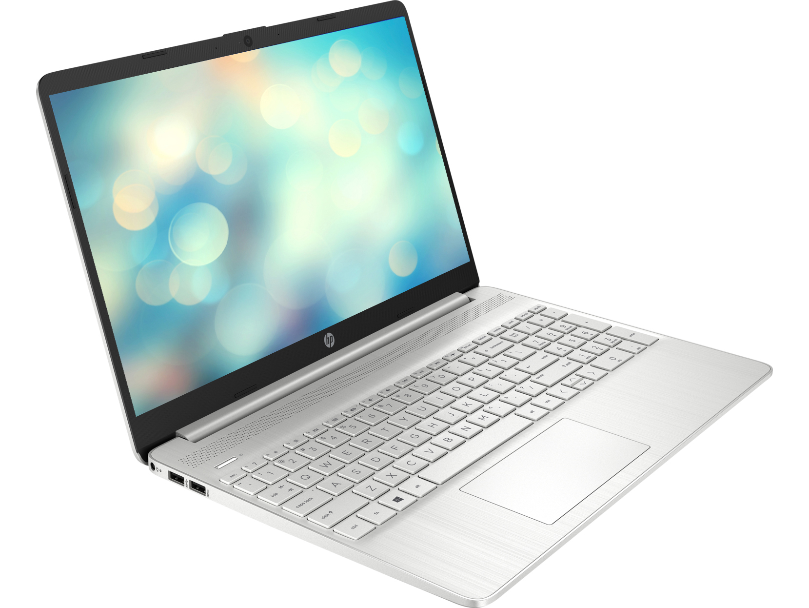 Un portátil HP plateado está abierto, mostrando un fondo borroso y teclado iluminado.