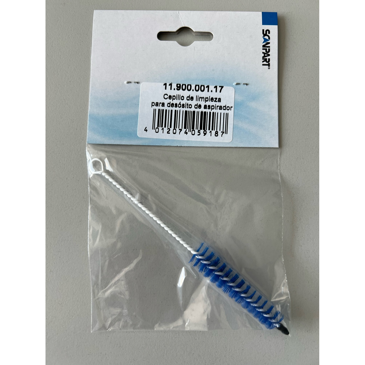 Cepillo de limpieza para aspiradora en un paquete de plástico.