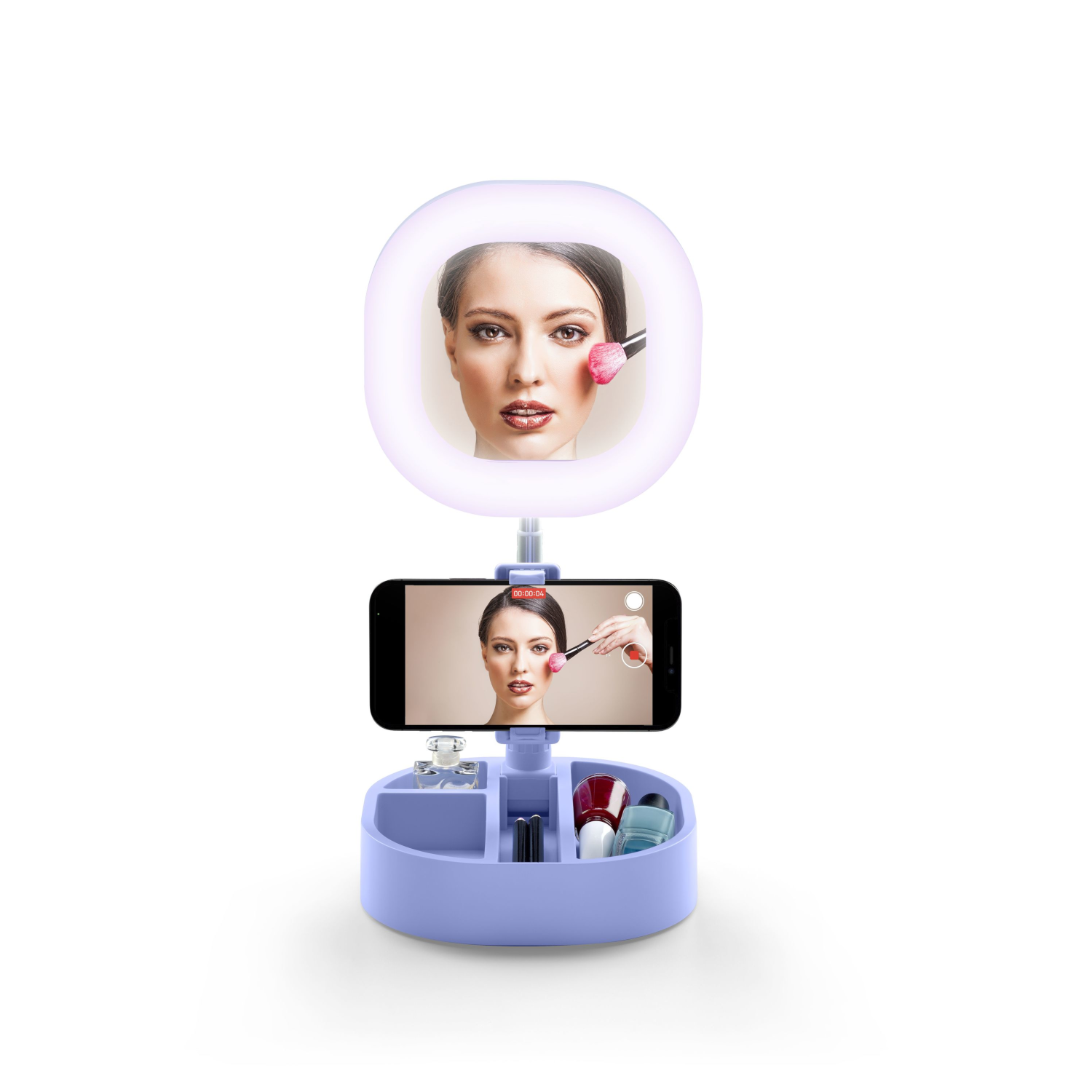 Makeup mirror with a phone showing a woman applying makeup, on a tray with products.