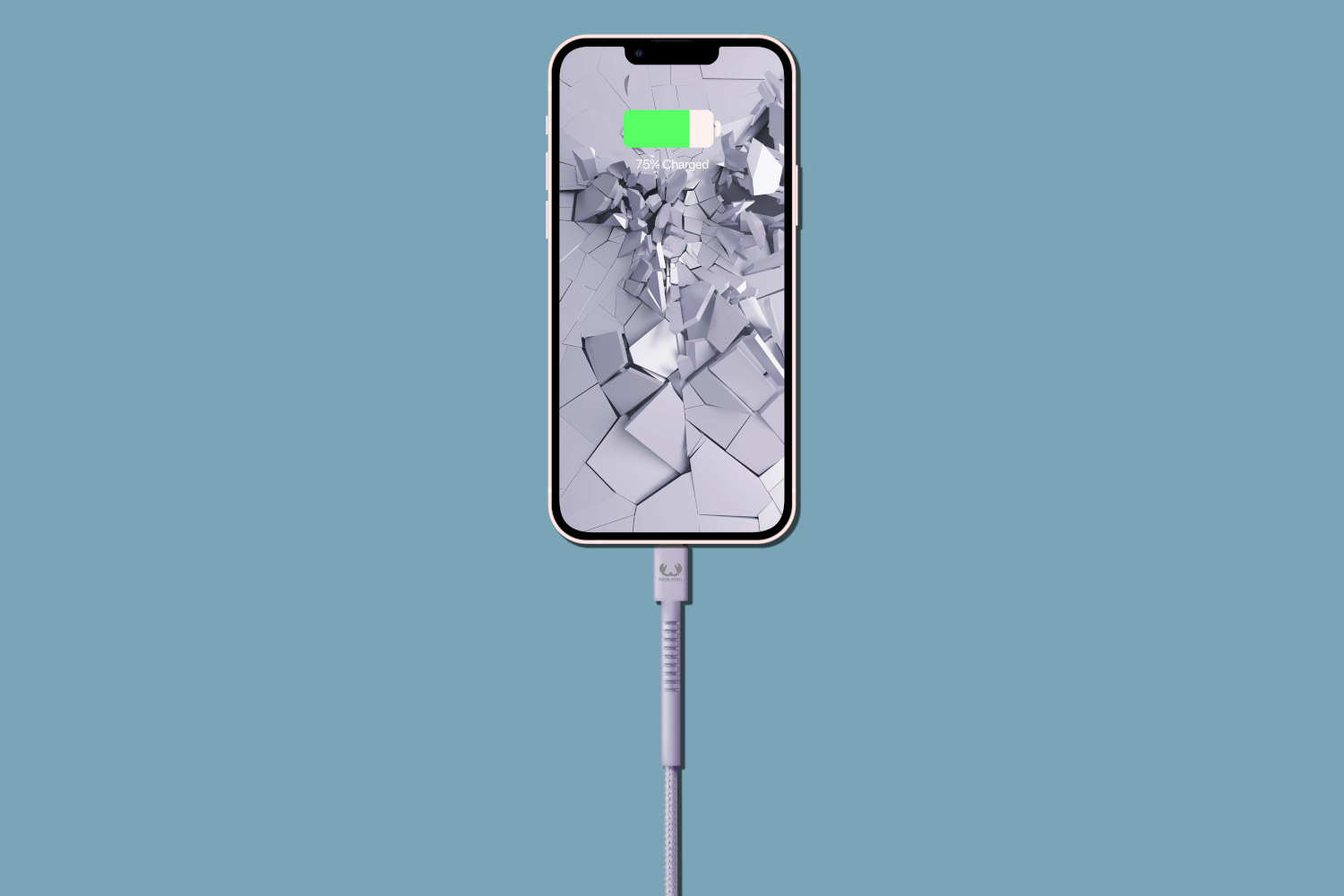 A smartphone is charging. The screen shows a cracked design and 75% charged.