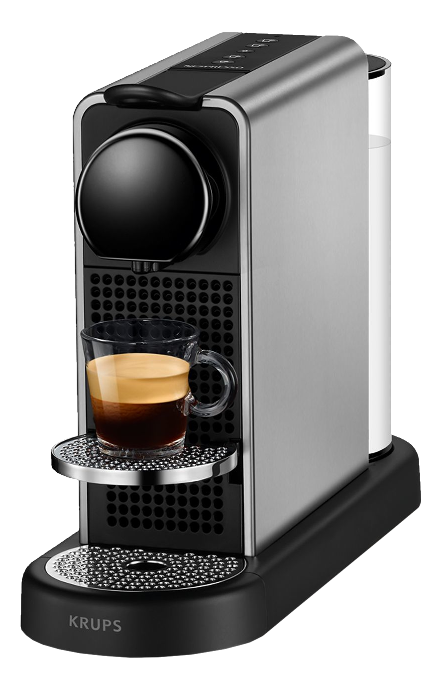 Macchina Krups Nespresso argento e nera con un bicchiere di espresso. Lo sfondo è nero.