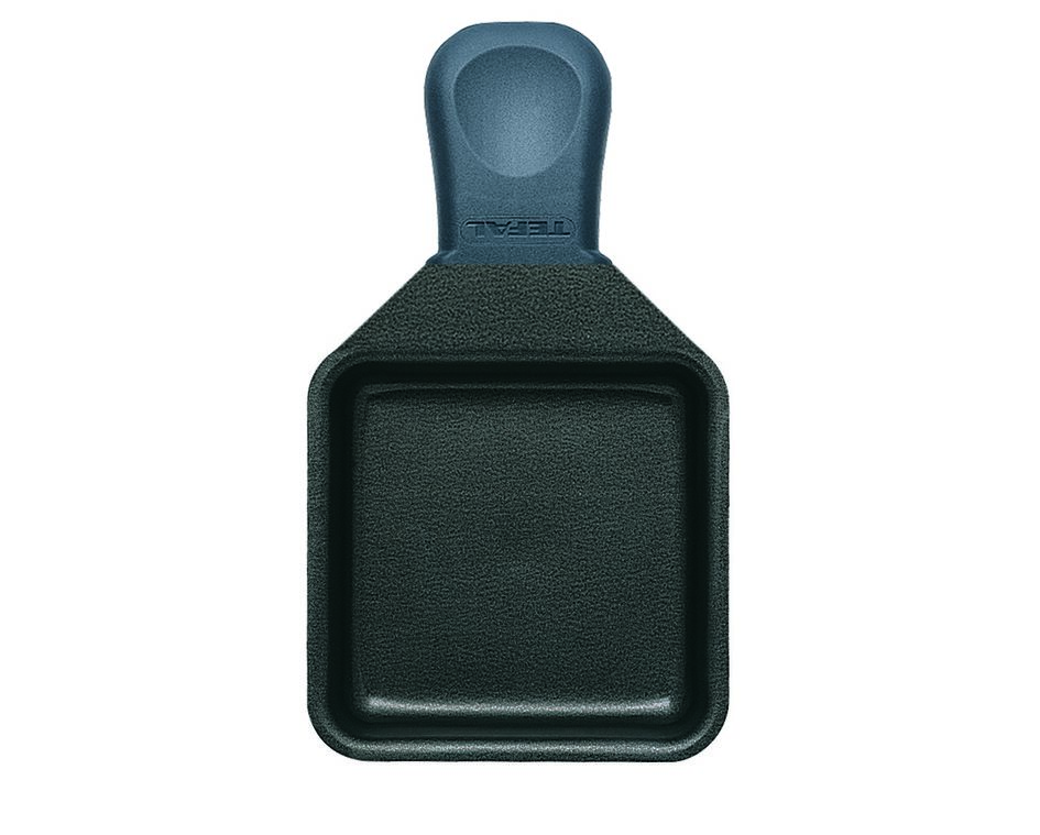A dark gray raclette pan with a handle. The brand name TEFAL is visible.