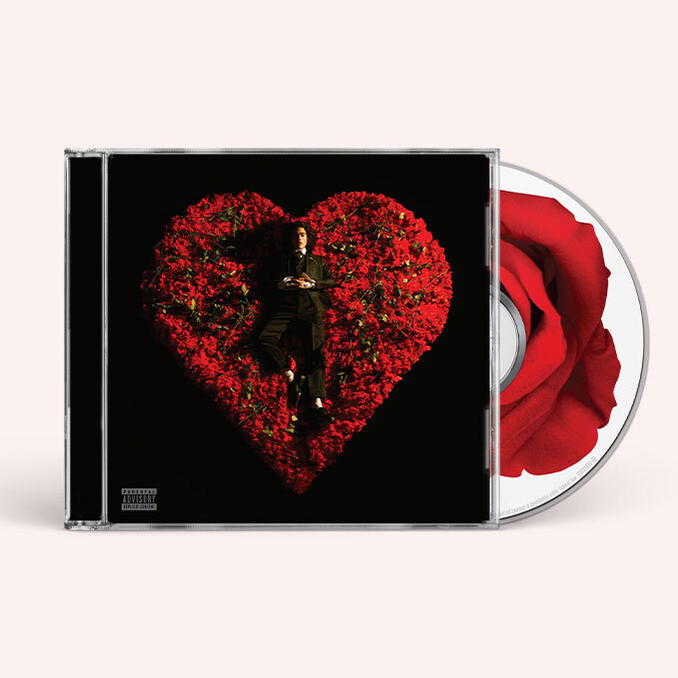 CD-Hülle: Ein Mann im Anzug liegt auf einem herzförmigen Bett aus roten Rosen, mit einer Rose seitlich.