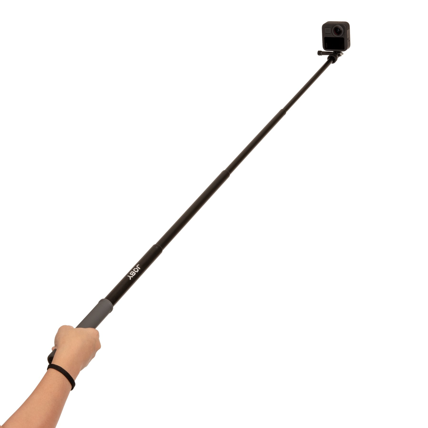 Person holding a black selfie stick with a GoPro camera attached.